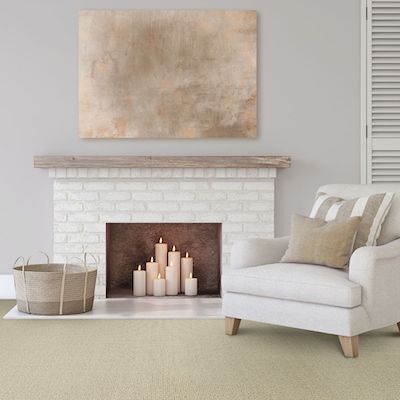 off white carpets in a Springfield IL living room with faux white brick fireplace