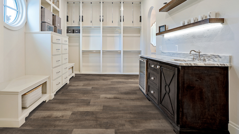 waterproof wood look luxury vinyl plank floors in a laundry room